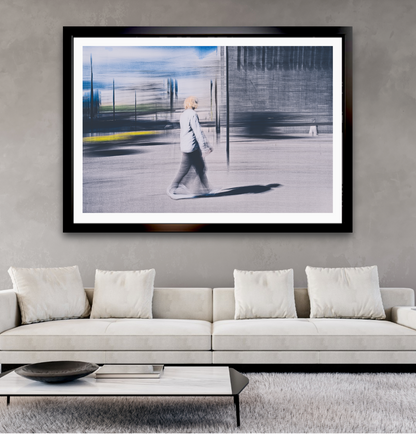 Passing Light a man walking through Oslo city streets pass the National Museum— ICM photography cycling wall art print by Douglas Carr at Oslo Art Prints