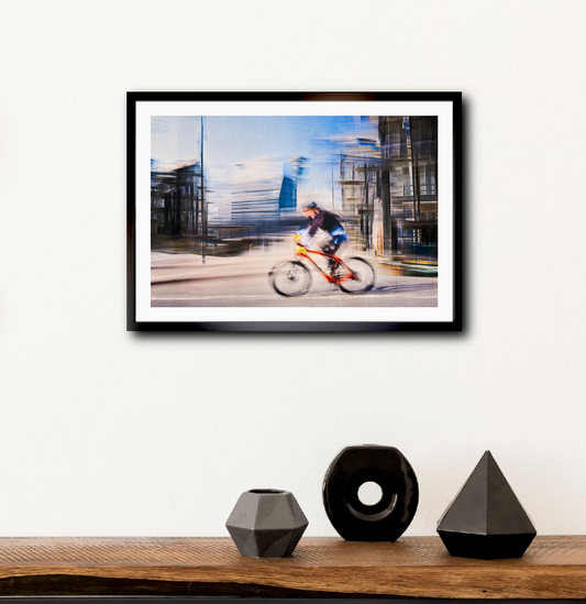 Passing Munch, a cyclist riding through Oslo city streets — ICM photography cycling wall art print by Douglas Carr at Oslo Art Prints