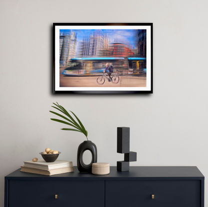 Downtown Deadline, a cyclist racing a tram through Oslo city streets — ICM photography cycling wall art print by Douglas Carr at Oslo Art Prints