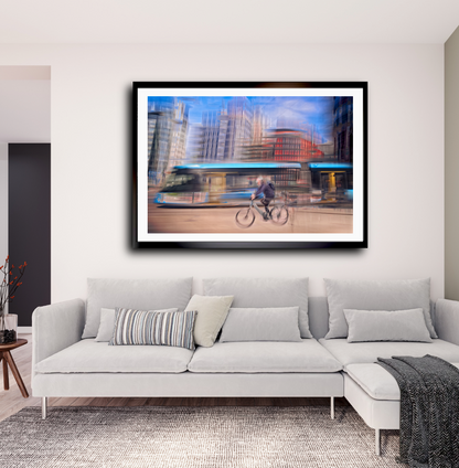 Downtown Deadline, a cyclist racing a tram through Oslo city streets — ICM photography cycling wall art print by Douglas Carr at Oslo Art Prints