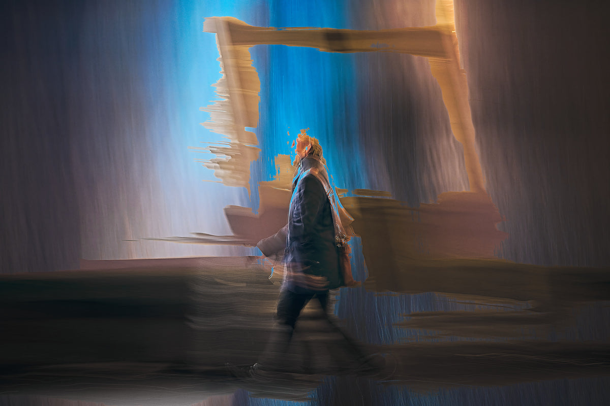 Between Light and Motion a man walking through Oslo city streets at night — ICM photography cycling wall art print by Douglas Carr at Oslo Art Prints