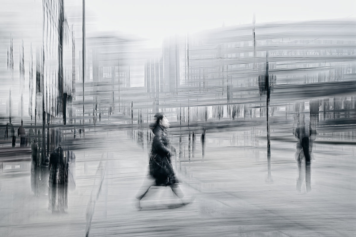 Blurred Intentions a person walking down Karl Johan in Oslo city towards Oslo train station  — Black & White ICM photography cycling wall art print by Douglas Carr at Oslo Art Prints