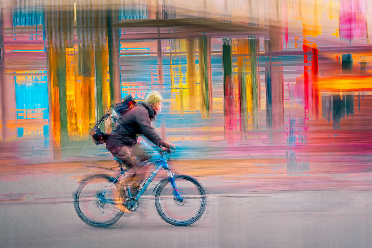 Candy Rush a cyclist riding through Oslo city streets — ICM photography cycling wall art print by Douglas Carr at Oslo Art Prints
