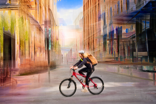 Chasing Light, a cyclist riding through Oslo city streets — ICM photography cycling wall art print by Douglas Carr at Oslo Art Prints
