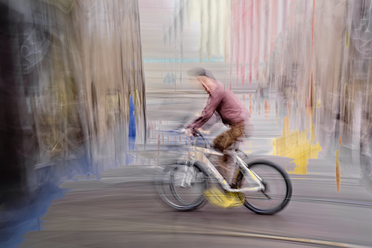 Impression of Passing, a cyclist riding through Oslo city streets — ICM photography cycling wall art print by Douglas Carr at Oslo Art Prints