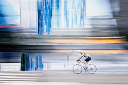 Linear Escape, a cyclist riding through Oslo city streets — ICM photography cycling wall art print by Douglas Carr at Oslo Art Prints