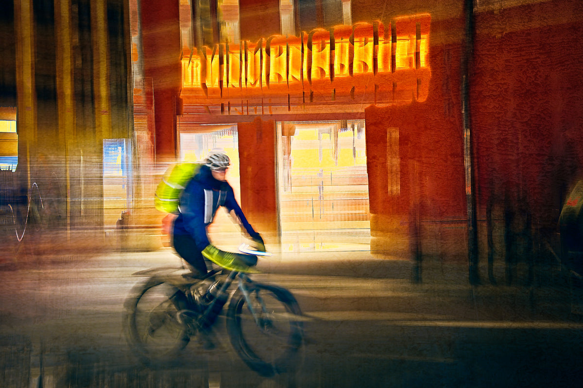 Passing Neon, a cyclist riding through Oslo city streets — ICM photography cycling wall art print by Douglas Carr at Oslo Art Prints