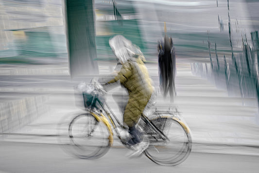 Seasoned Cyclist, a cyclist riding through Oslo city streets — ICM photography cycling wall art print by Douglas Carr at Oslo Art Prints