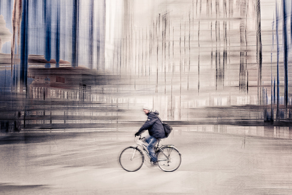 Silent Commuter, a cyclist riding through Oslo city streets — ICM photography cycling wall art print by Douglas Carr at Oslo Art Prints