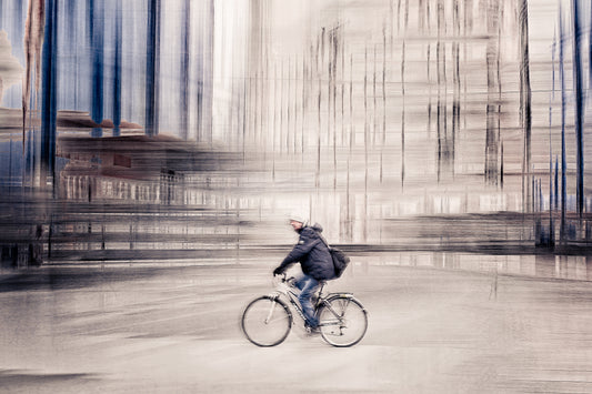 Silent Commuter, a cyclist riding through Oslo city streets — ICM photography cycling wall art print by Douglas Carr at Oslo Art Prints